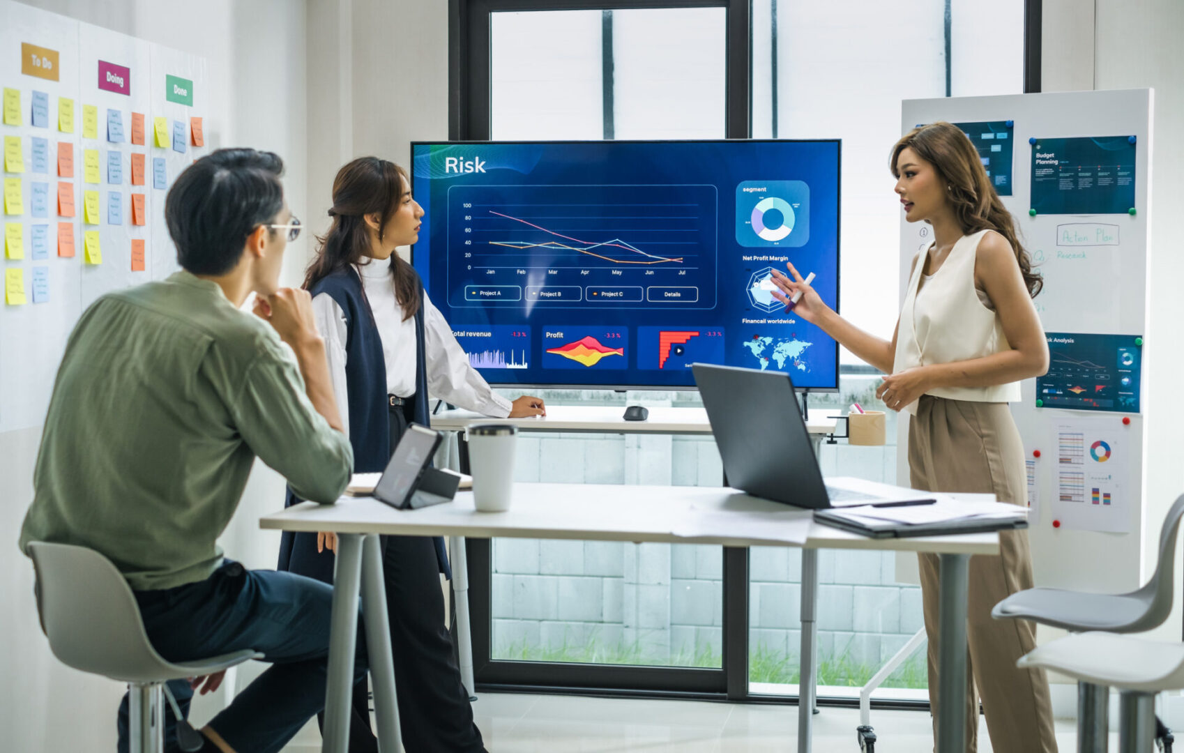 Business team discussing data analytics in a modern office meeting.